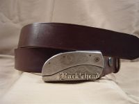 brown leather belt with belt buckle knife